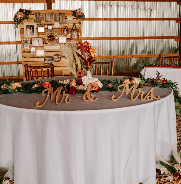 Elegant wedding reception table featuring wooden 